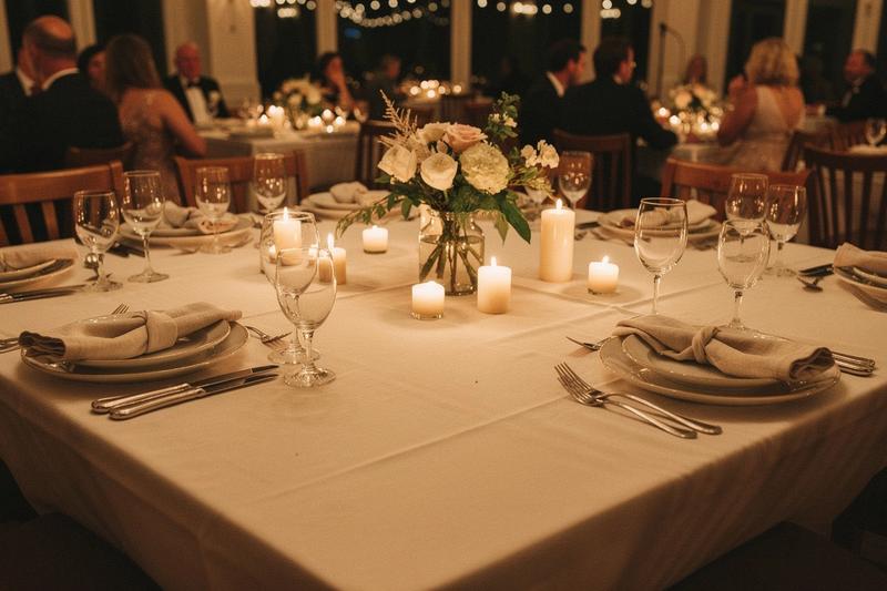 Candlelit table setting during a wedding dinner